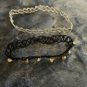 Set of 2 chokers. One silver and one black with rhinestones